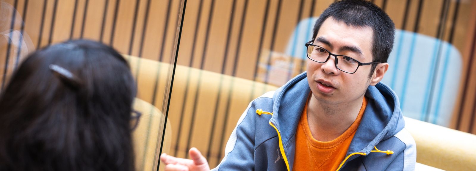 Two international students sitting chatting
